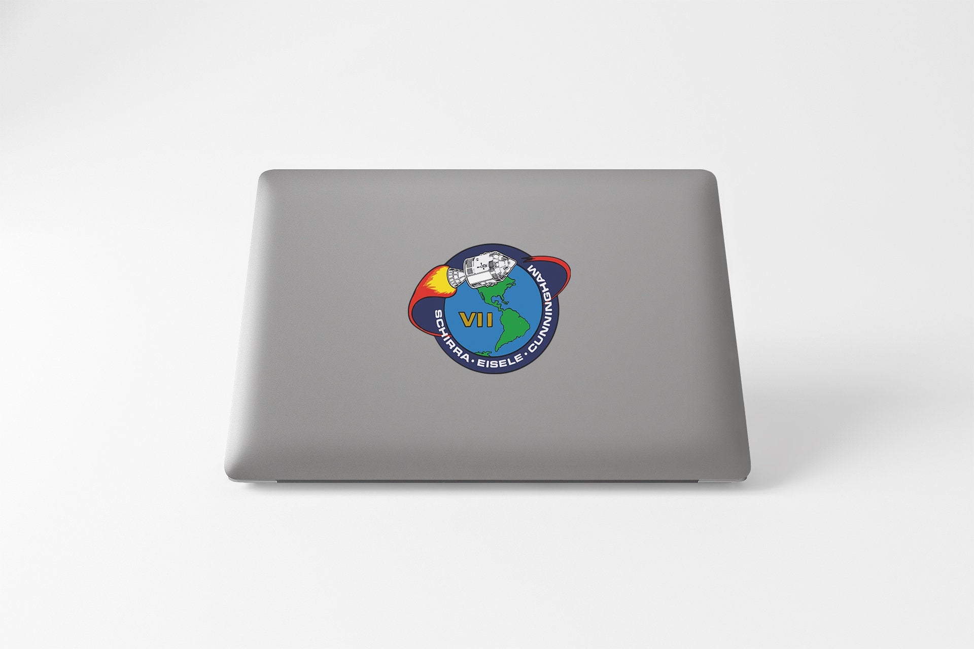 a laptop with a sticker of a cartoon character on it