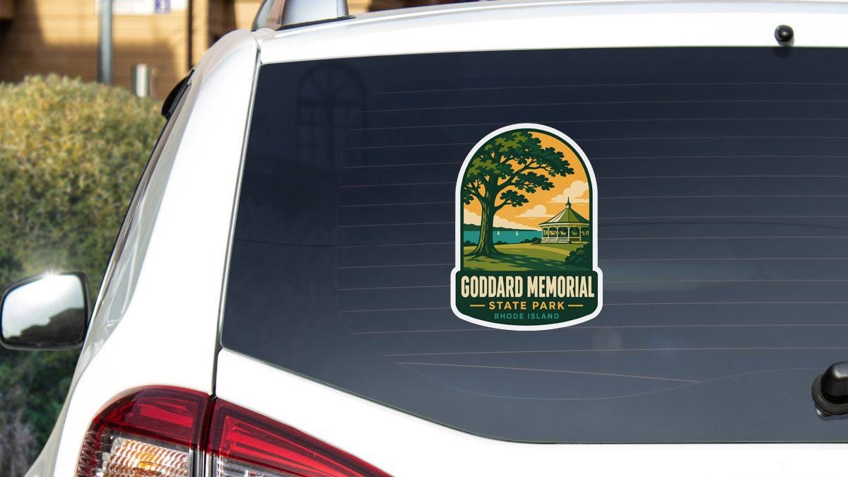 A sticker on the rear window of a white car, depicting a scenic landscape with a tree and a building, indicating that it is a sticker for Goodard Memorial State Park.