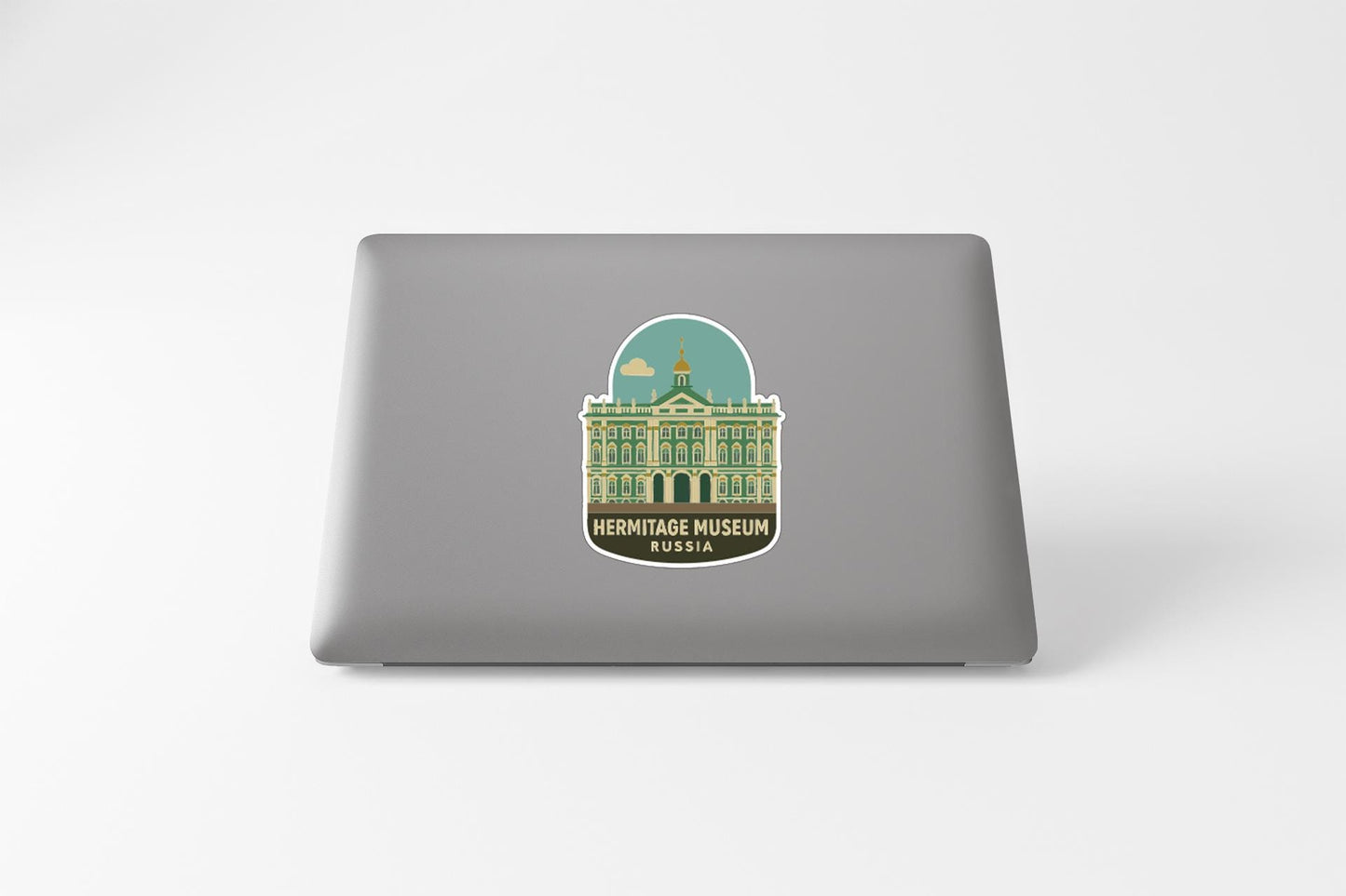 a sticker or decal of the Hermitage Museum in Russia on the back of a laptop computer.