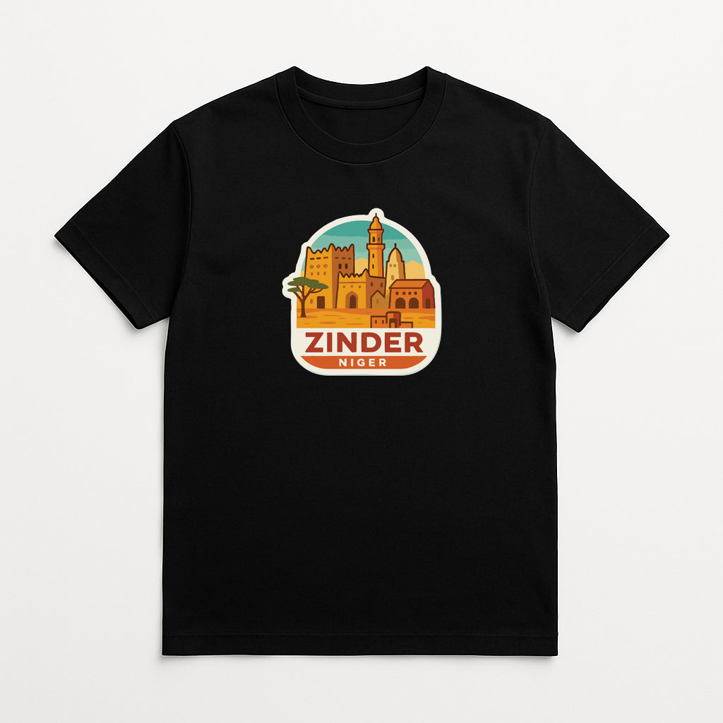 A black t-shirt with a graphic design depicting a cityscape and the text "ZINDER NIGER" printed on it.