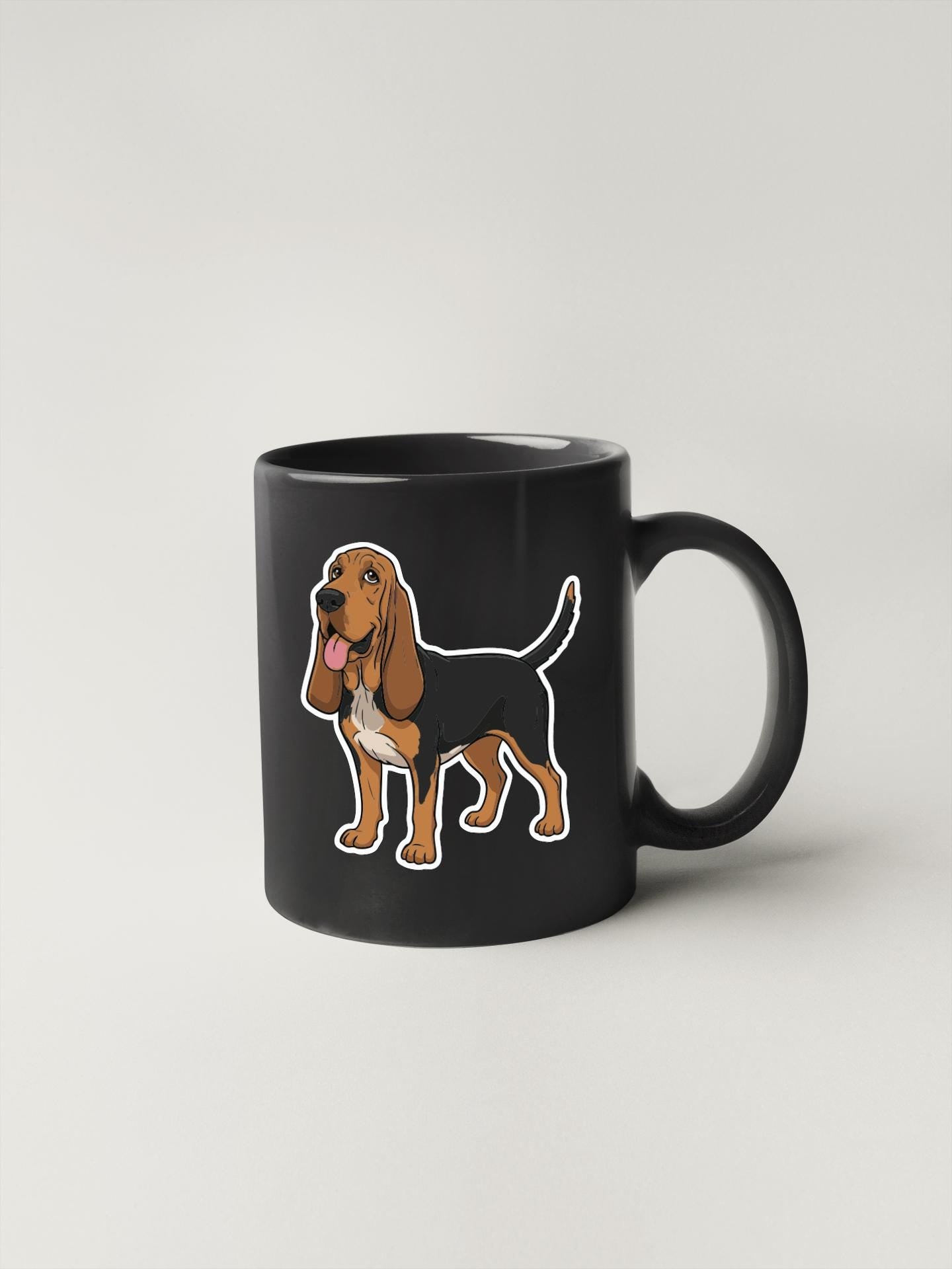 A black mug with a cartoon illustration of a dog on it.
