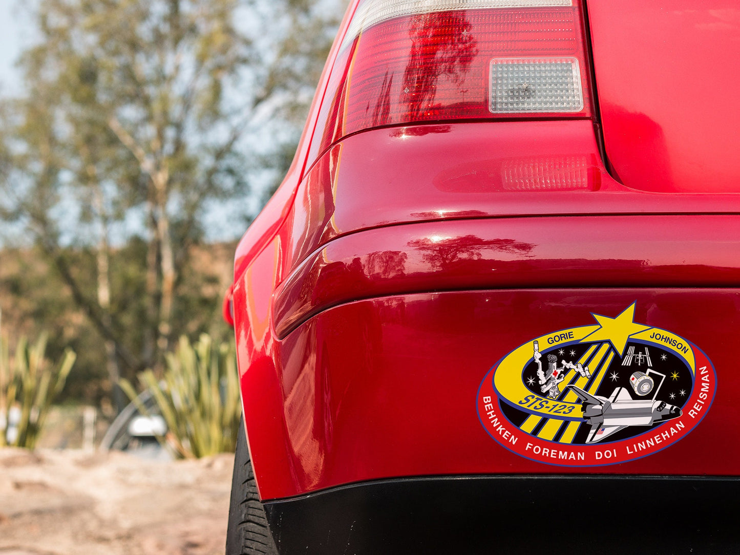 a close up of the rear end of a red car