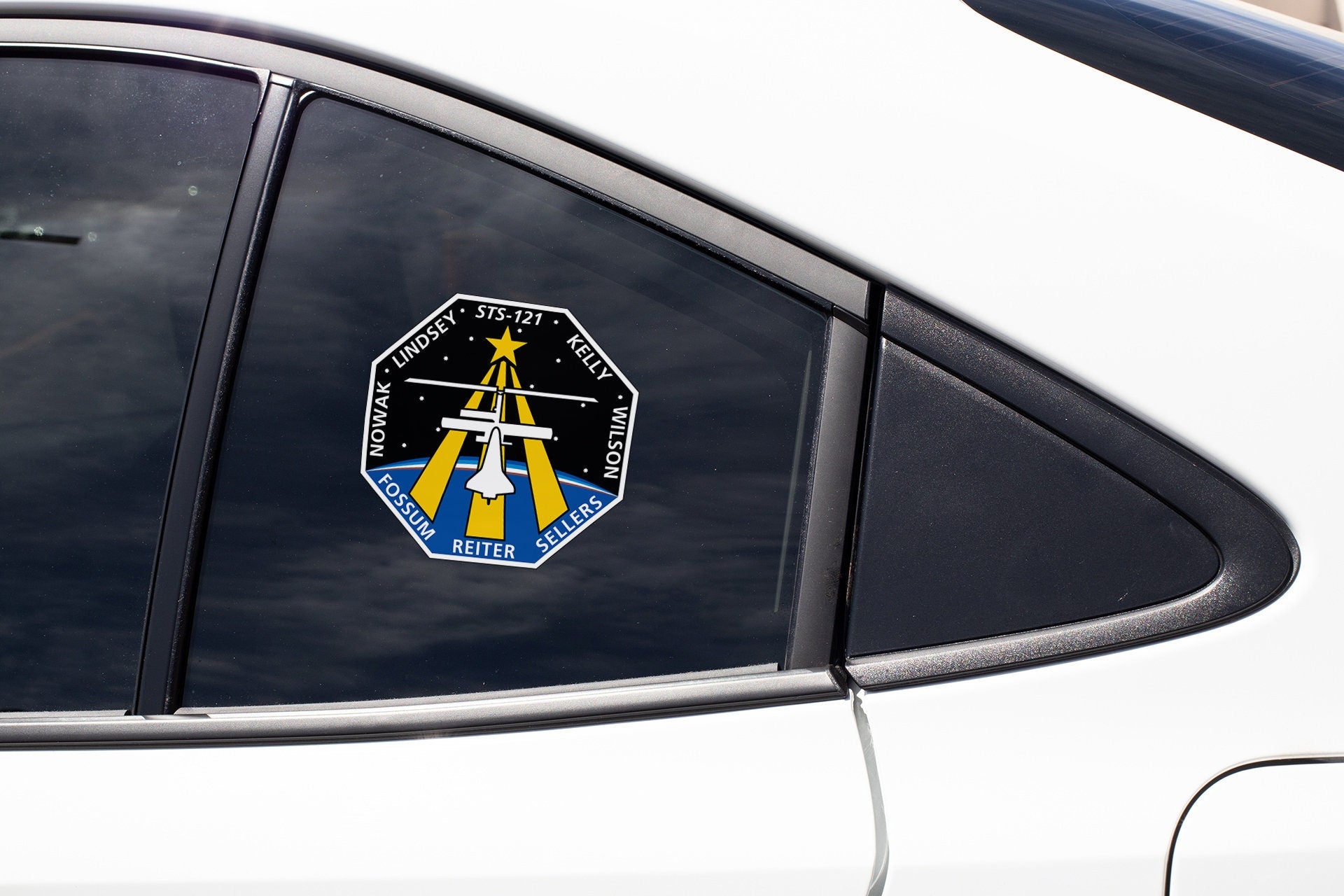 a close up of a car window with a sticker on it
