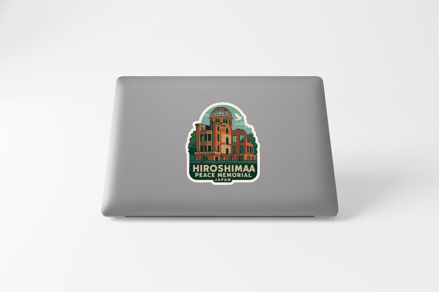a sticker with an illustration of a building, which appears to be the HRF Memorial in Japan.