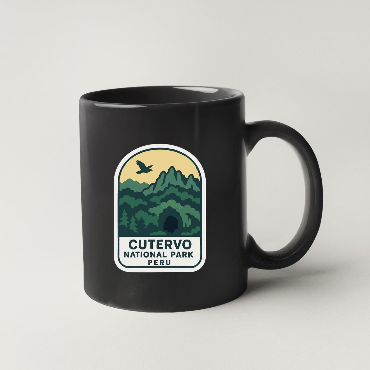 A black coffee mug with a label that says "CUTERVO NATIONAL PARK PERU".