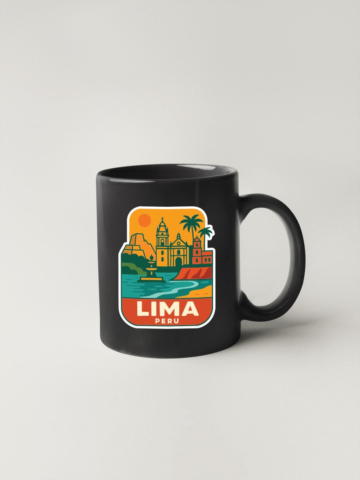 A black coffee mug with a colorful sticker depicting the cityscape of Lima, Peru.