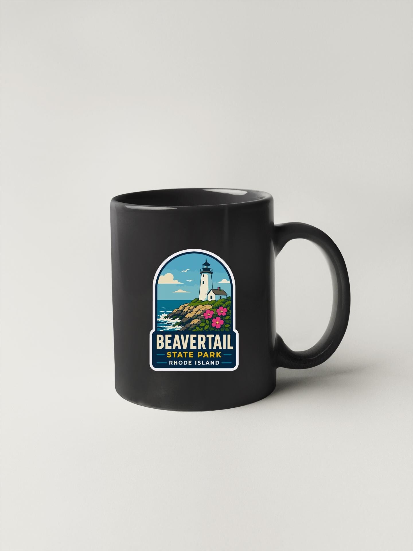 A black coffee mug with a label that says "BEAVERTail State Park, Rhode Island".