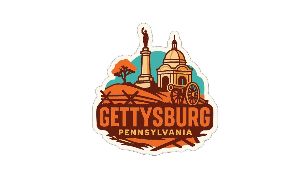 A sticker or logo depicting the city of Gettysburg, Pennsylvania, with a statue, a building, and a wagon wheel.
