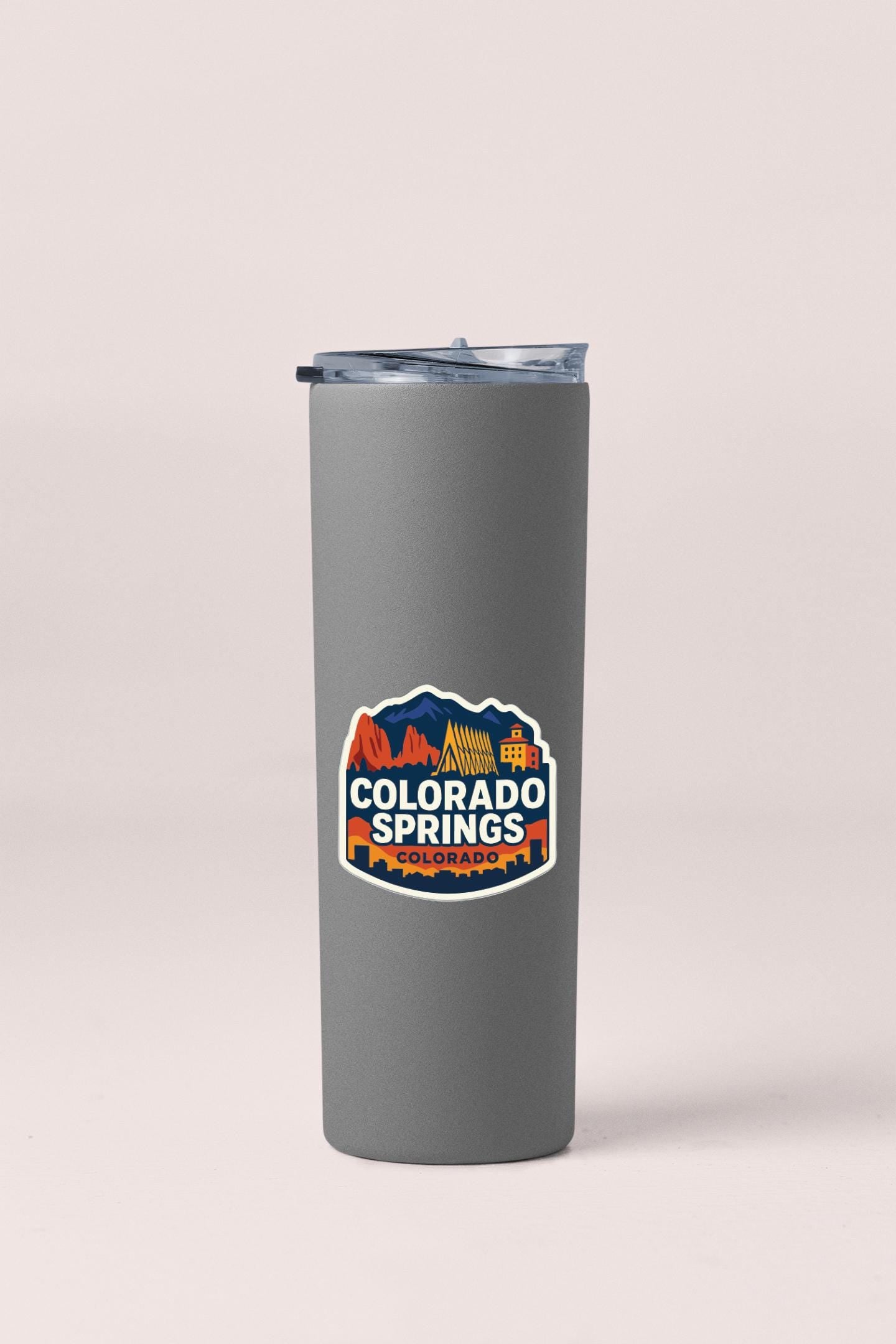 A gray insulated tumbler with a logo that says "COLORADO SPRINGS COLORADO" printed on it.