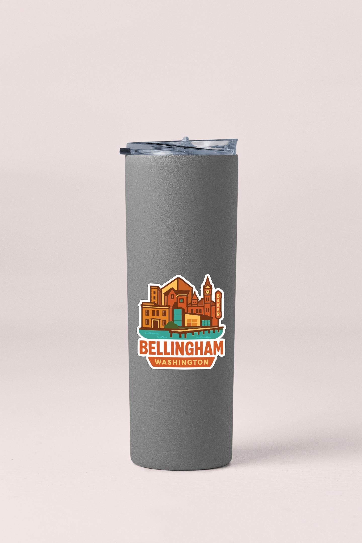 A gray insulated tumbler with a printed design of a cityscape and the text "Bellingham Washington" on it.