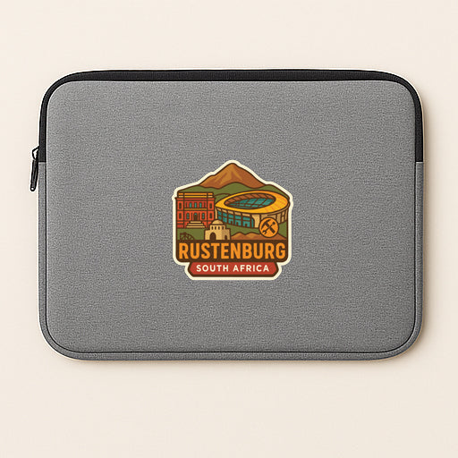 A gray laptop sleeve with a graphic design featuring a mountain, buildings, and text that says "RUSTENBURG SOUTH AFRICA".