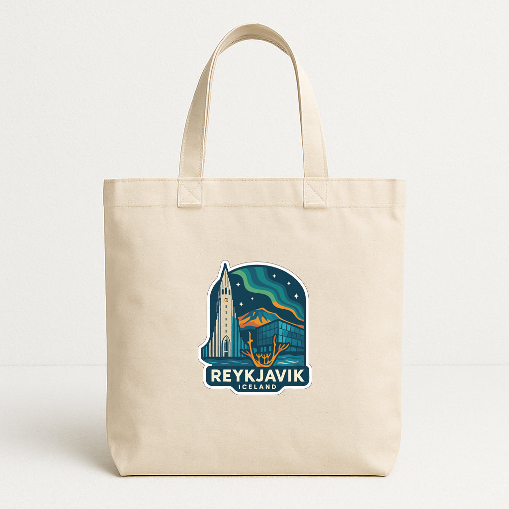 A beige tote bag with a graphic design featuring the Reykjavik, Iceland logo.