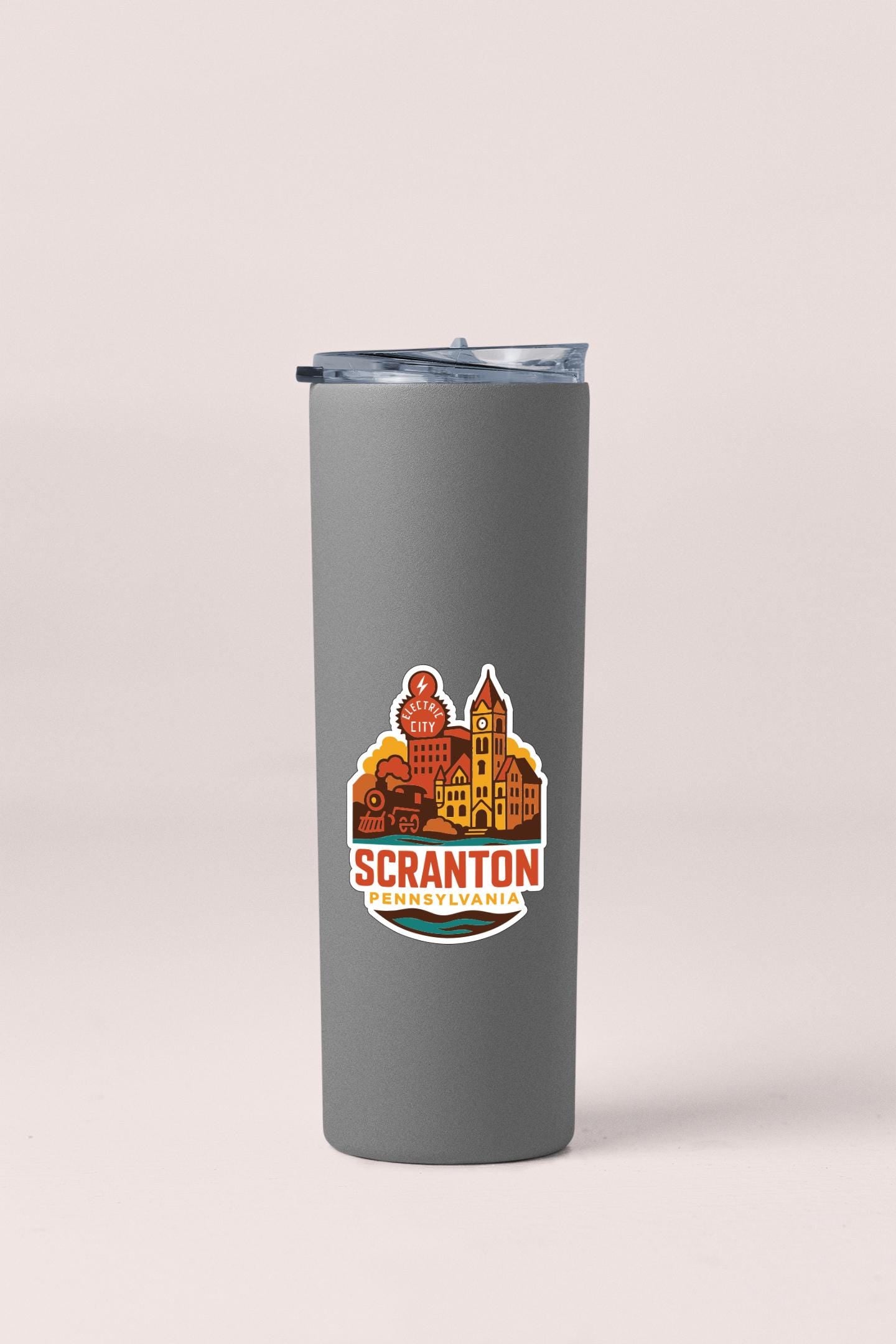 A gray insulated tumbler with a printed design of a city skyline and the text "Scranton, Pennsylvania" on it.