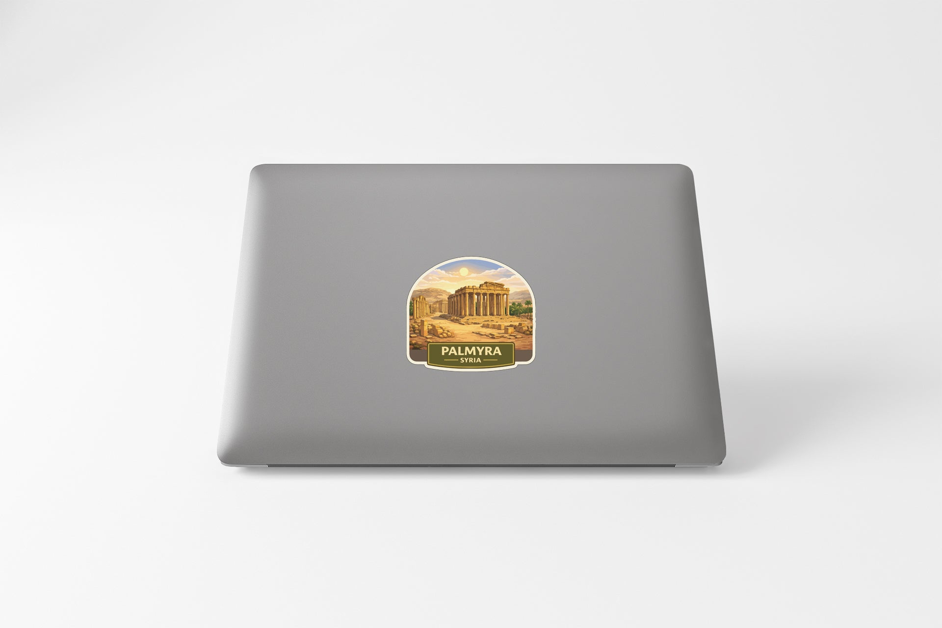 a sticker of a building on the back of a laptop.