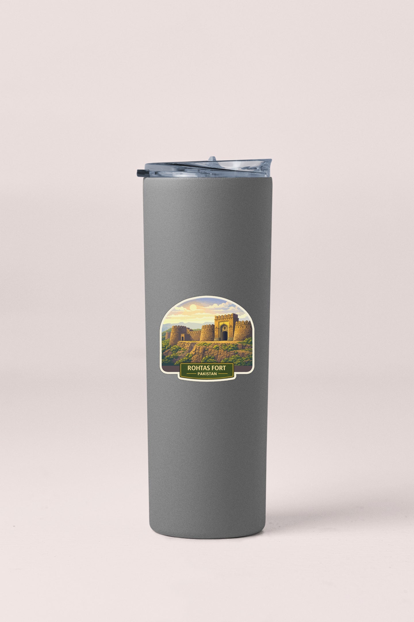 A gray cylindrical container with a label depicting a castle or fort.