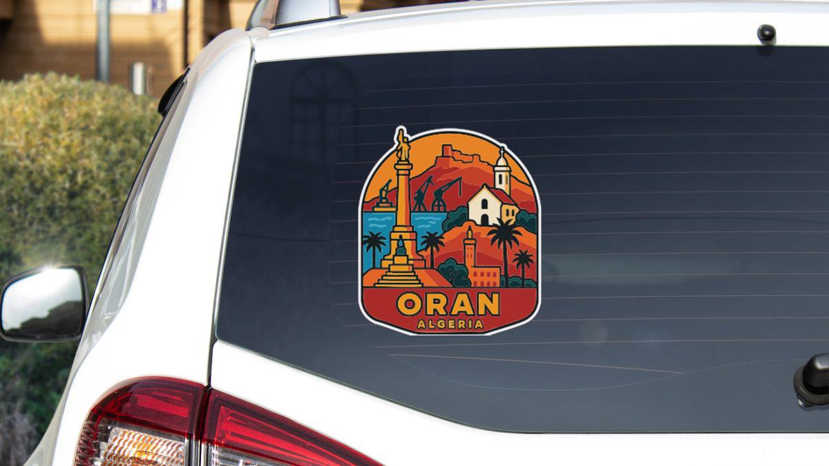 a sticker on the rear window of a car, depicting a scenic view of Oran, Algeria.