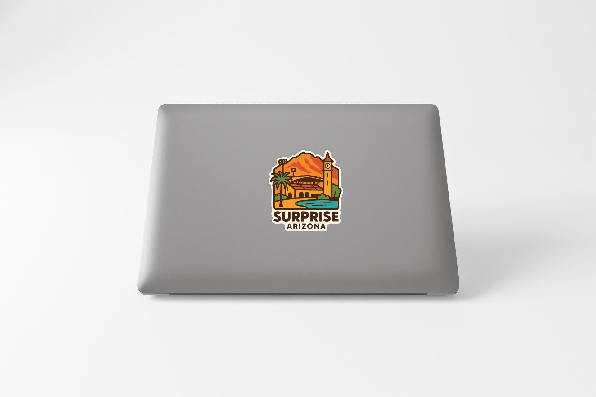 a sticker on the back of a laptop that says "Surprise Arizona".
