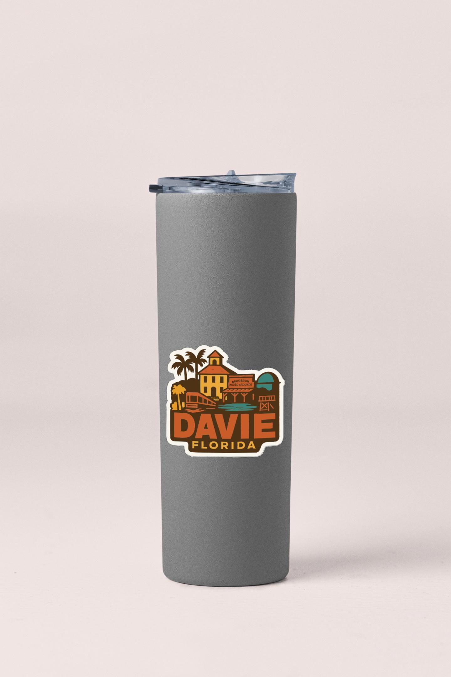 A gray insulated tumbler with a sticker that says "DAVID FLORIDA".