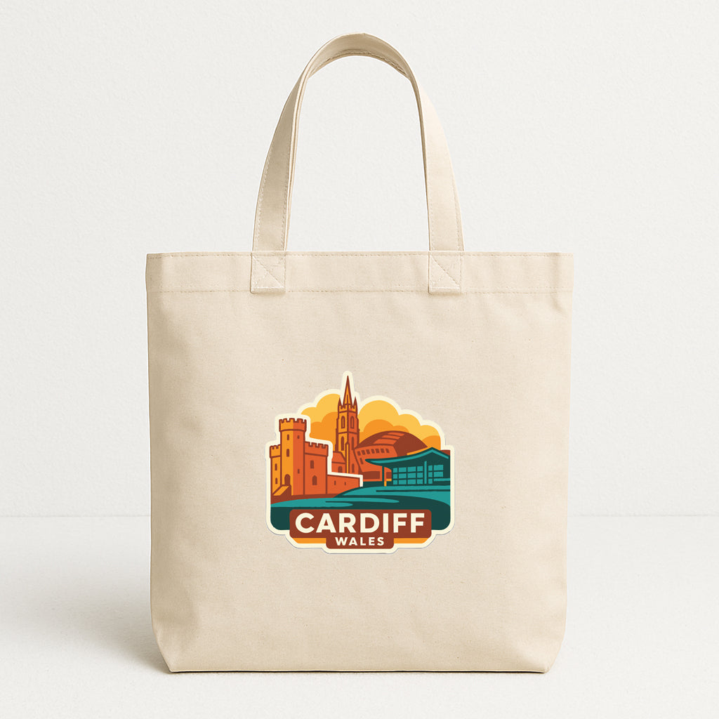 A beige tote bag with a printed design of a city skyline and the text "CARDIFF WALES" printed on it.