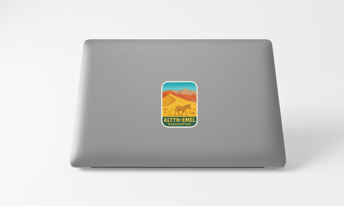 a sticker with a desert landscape and a horse on a laptop.