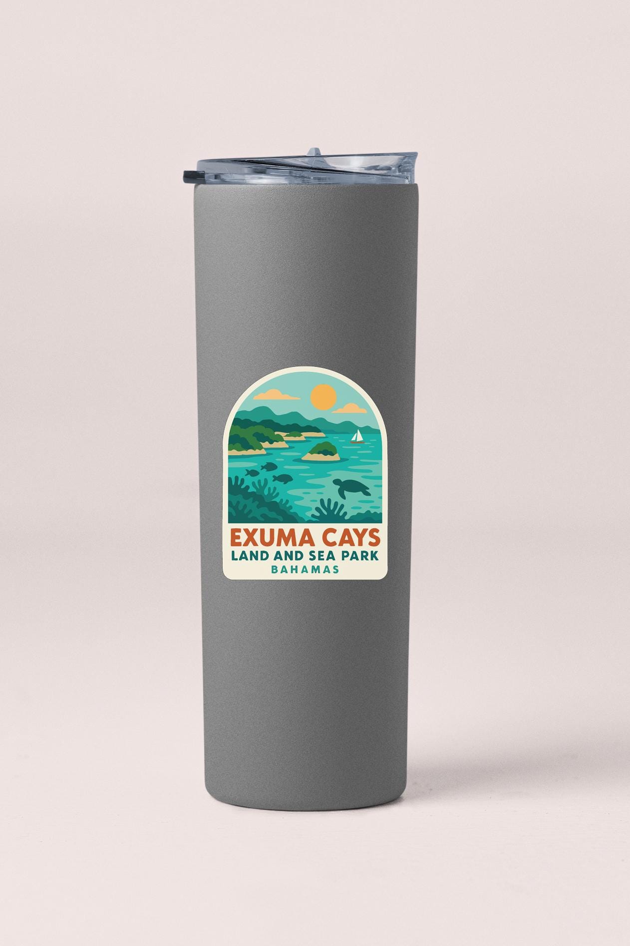 A gray tumbler with a label that says "Exuma Cays Land and Sea Park Bahamas".