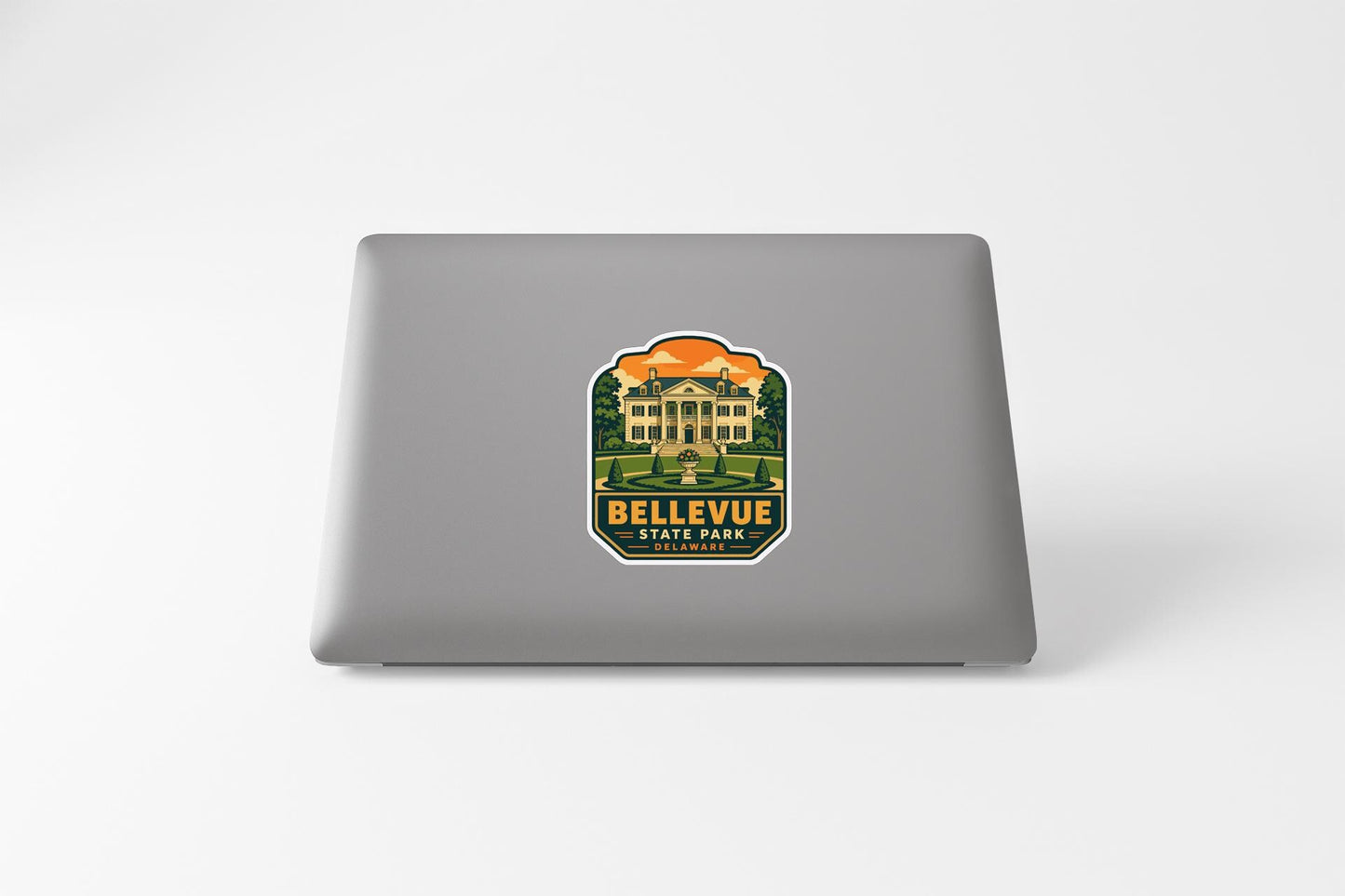 a sticker with a graphic of a building and the text "Bellevue State Park" on a laptop.