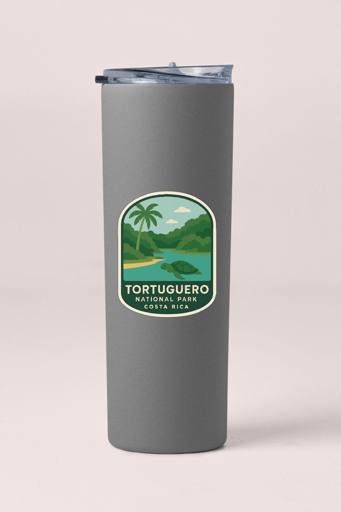 A gray cylindrical container with a label that says "Tortuquero National Park Costa Rica".