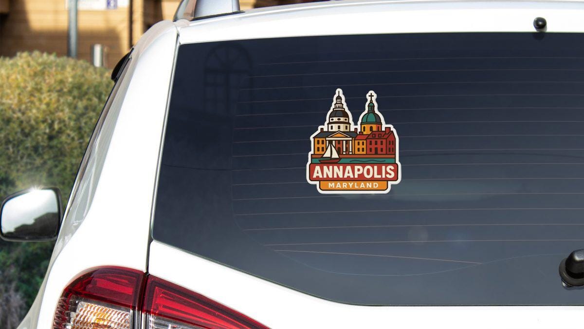 a sticker on the rear window of a white car, depicting the Annapolis, Maryland city.