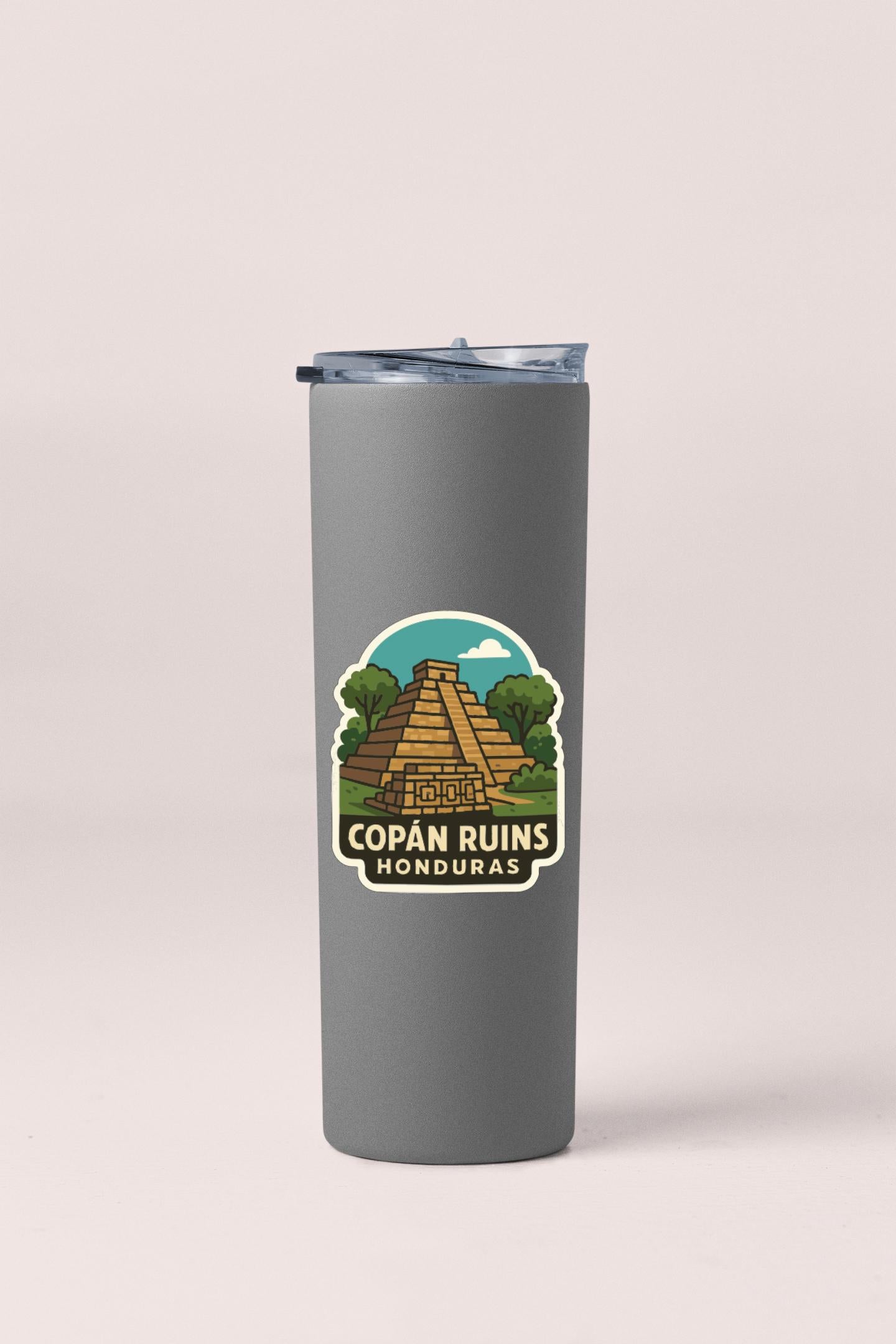 A gray tumbler with a sticker depicting the Copan Ruins in Honduras.