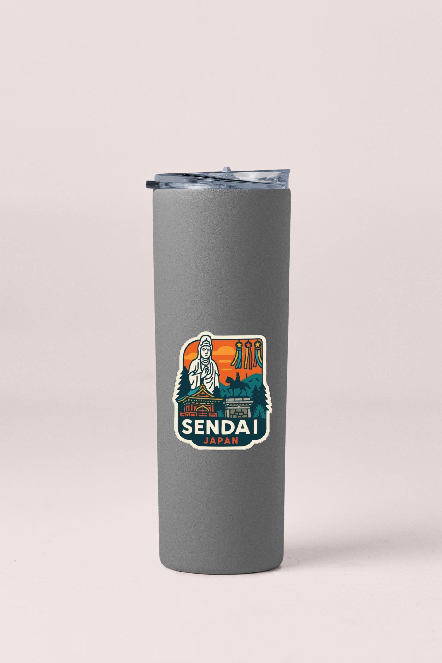 A gray insulated tumbler with a sticker featuring a stylized illustration of a person and text.