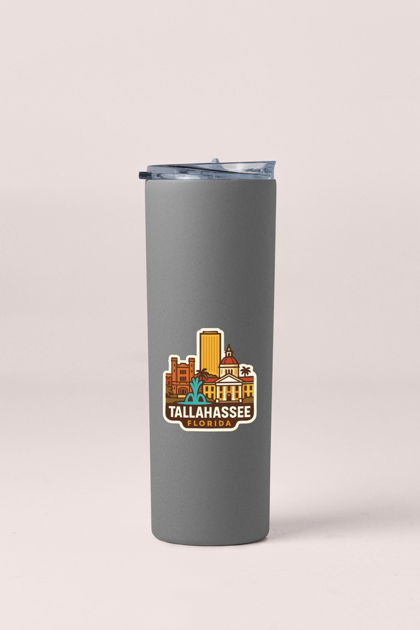 A gray insulated tumbler with a printed design of Tallahassee, Florida on it.
