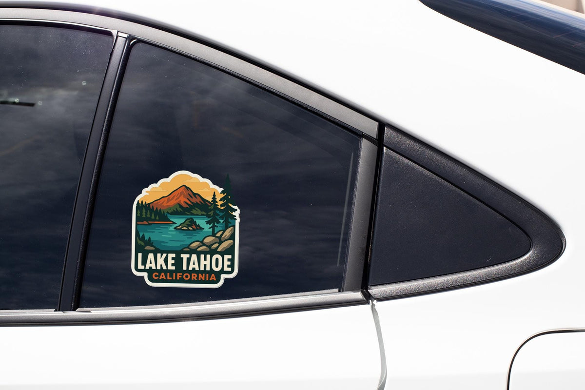 A sticker on the side of a car window that says "LAKE TAHOE, CALIFORNIA".