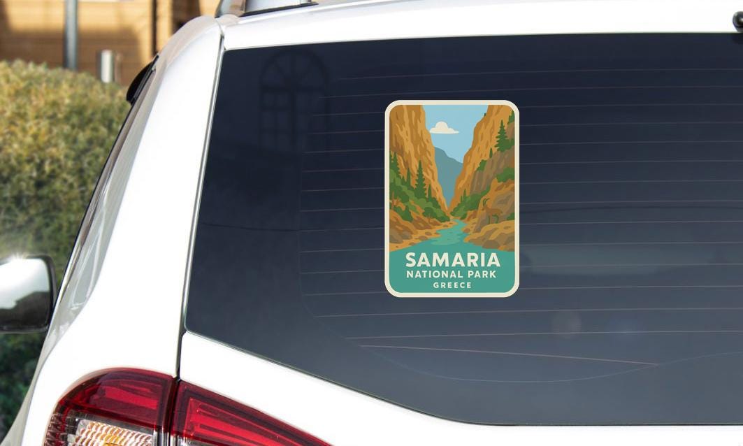 A sticker on the rear window of a car that says "SAMARIA NATIONAL PARK GREECE".