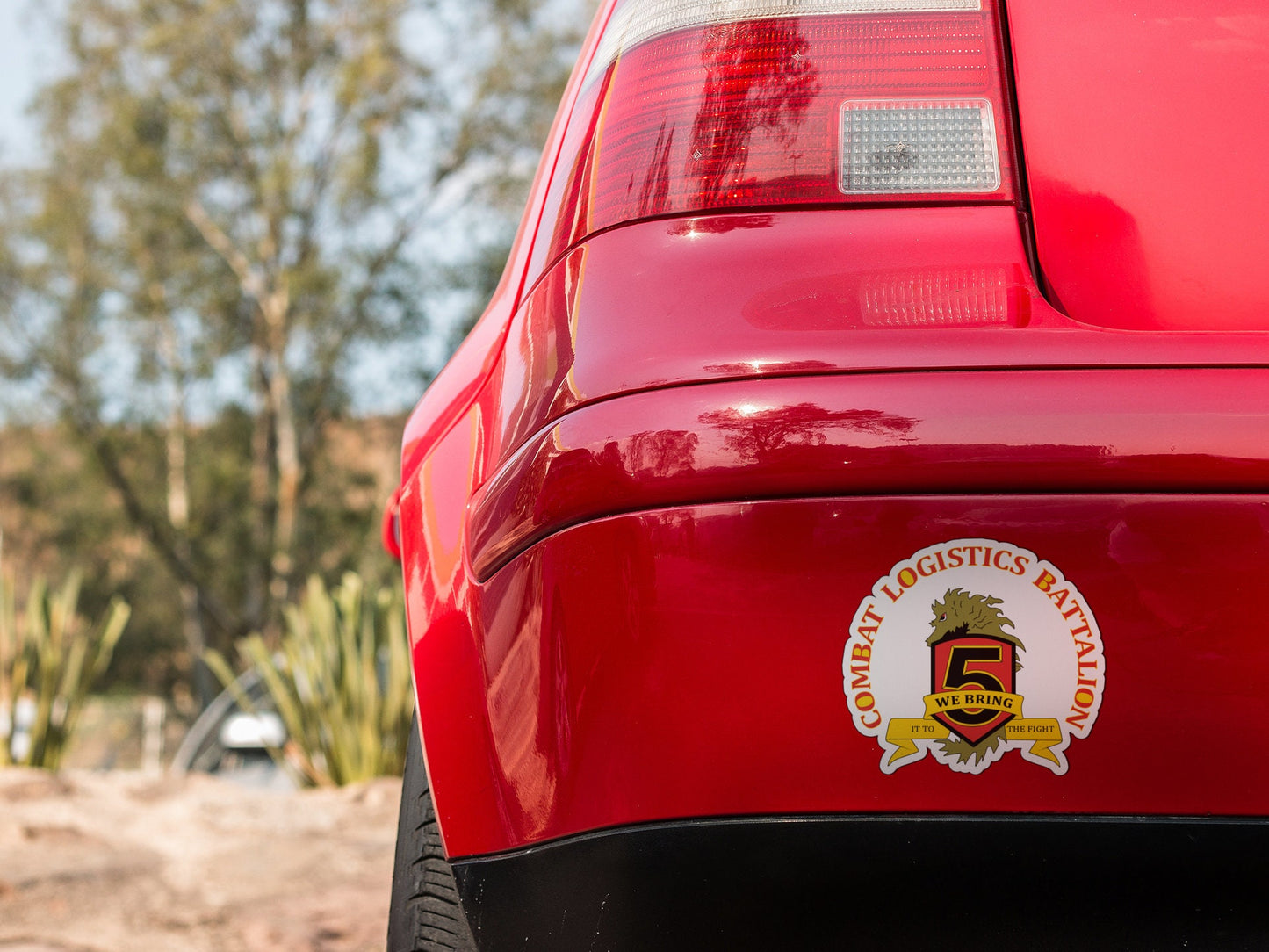 a close up of the tail end of a red car