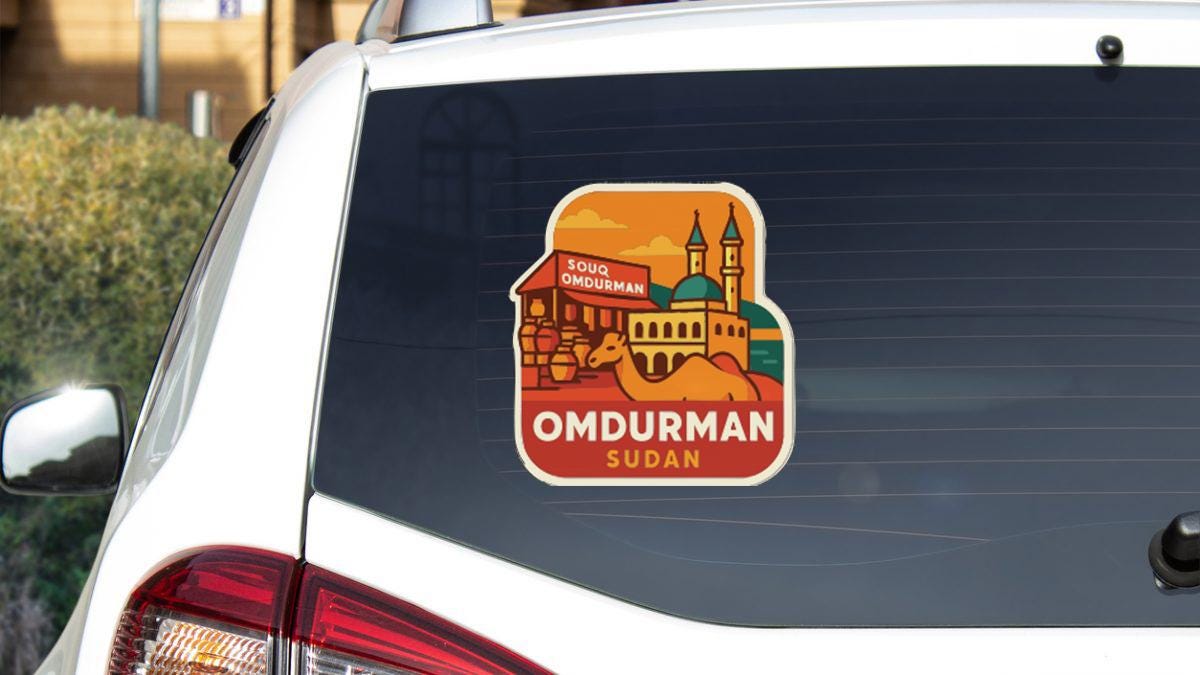 A sticker on the rear window of a white car, depicting a cityscape with a castle and a camel, along with the text "OMDURMAN SUDAN".