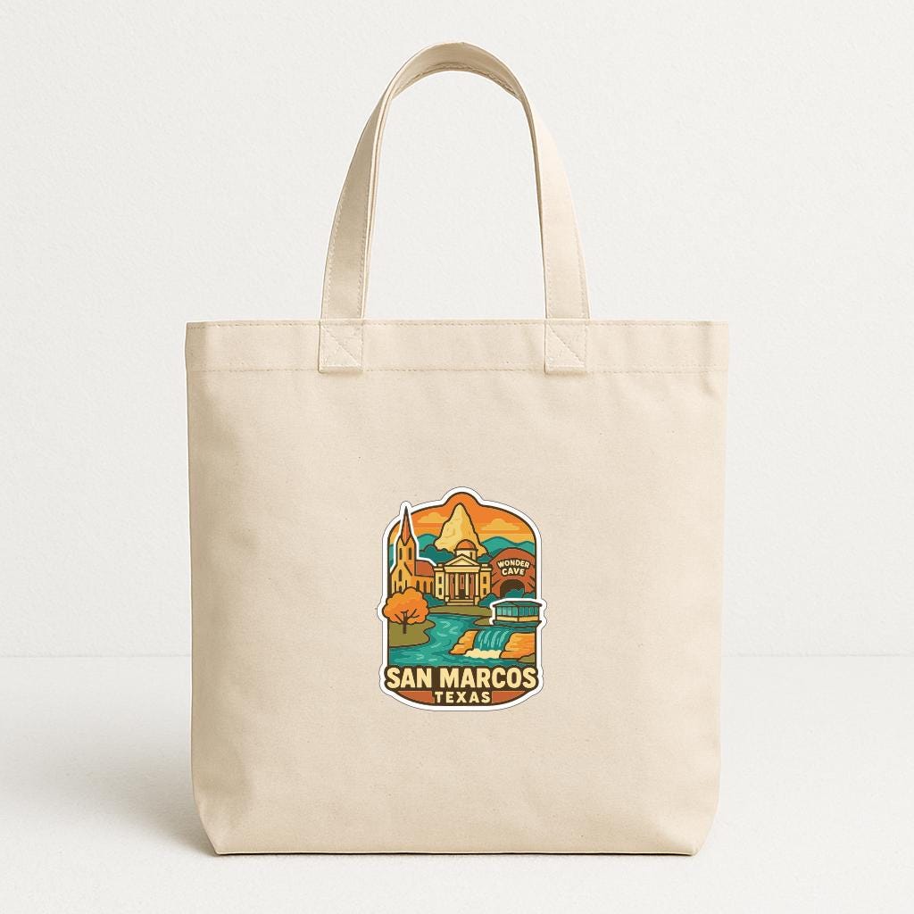 A beige tote bag with a printed design depicting a scenic view of San Marcos, Texas.