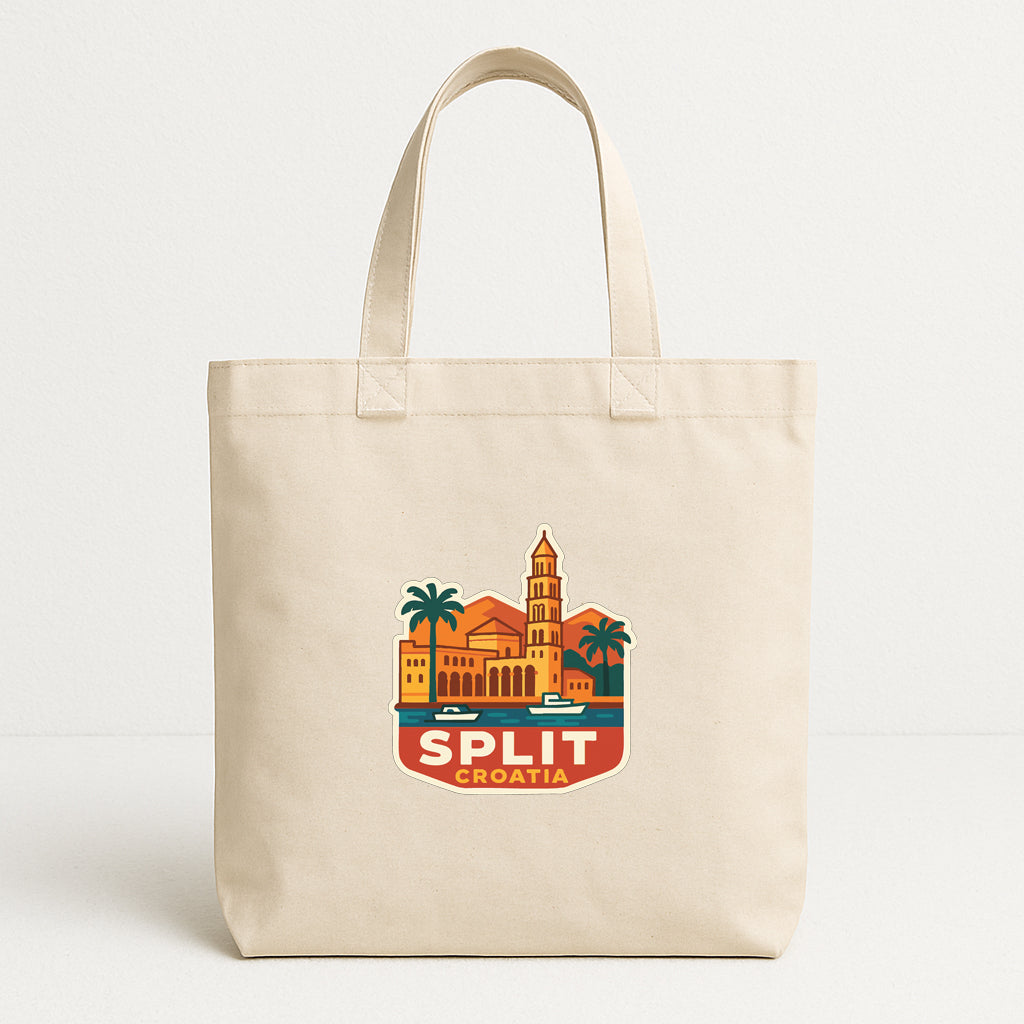 A beige tote bag with a graphic design depicting a building and palm trees, along with the text "SPLIT CROATIA".