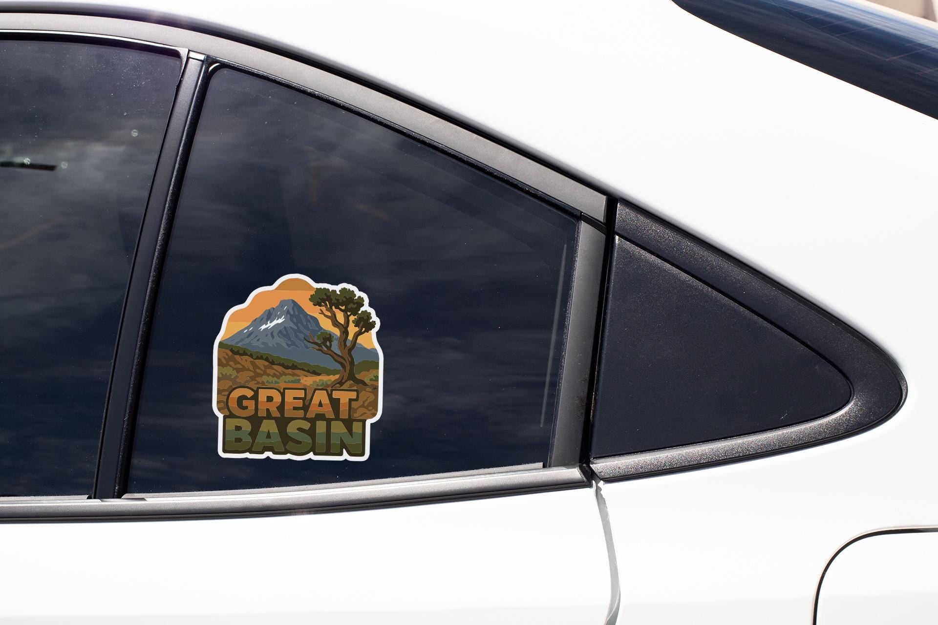 A sticker on the side of a car window that says "GREAT BASIN".