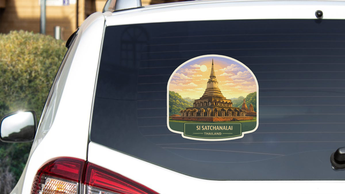 Sticker on rear window of a white car depicting a temple in Thailand.