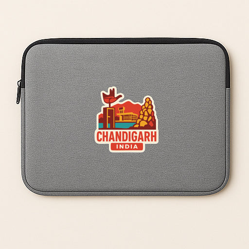 a gray laptop sleeve with a colorful sticker depicting the city of Chandigarh, India.