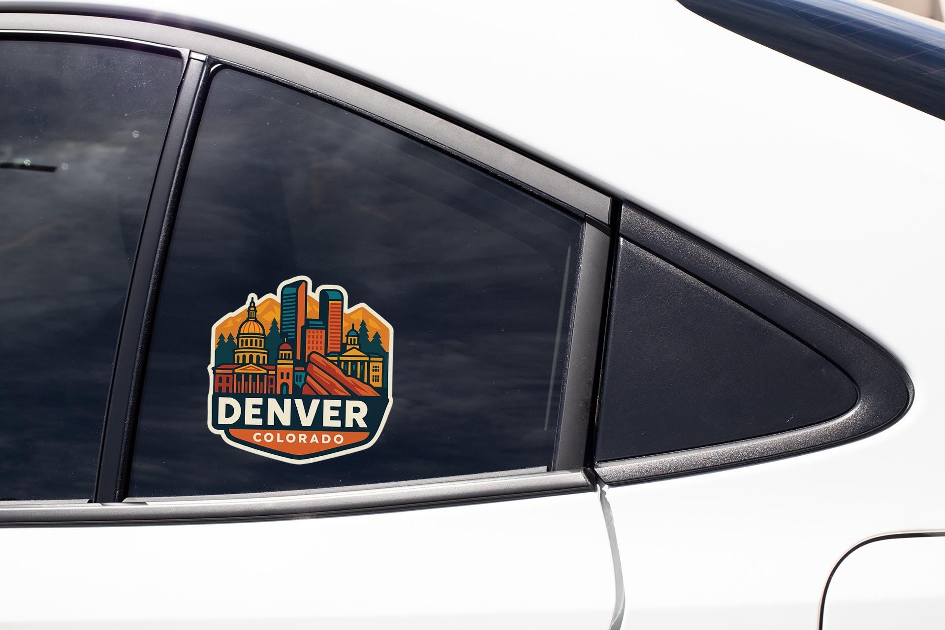 a car with a denver sticker on it's side window