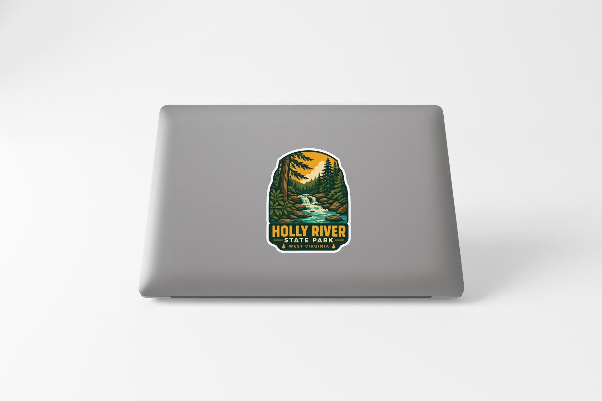 A sticker featuring a scenic landscape with a river, trees, and mountains, along with the text "Holly River State Park".