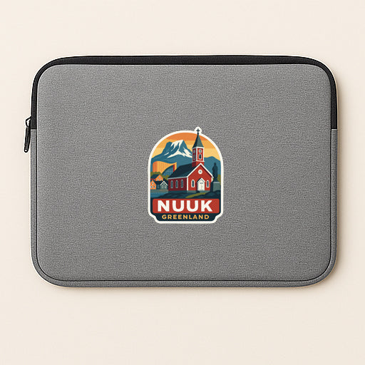 A gray laptop sleeve with a colorful graphic of a church and mountains, along with the text "NUUK GREENLAND".