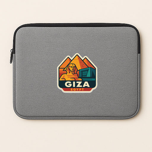 A gray laptop sleeve with a sticker depicting the Giza pyramid and the word "Giza" printed on it.