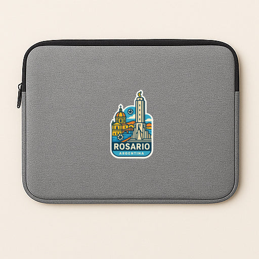 a gray laptop sleeve with a sticker of Rosario, a city in Argentina.