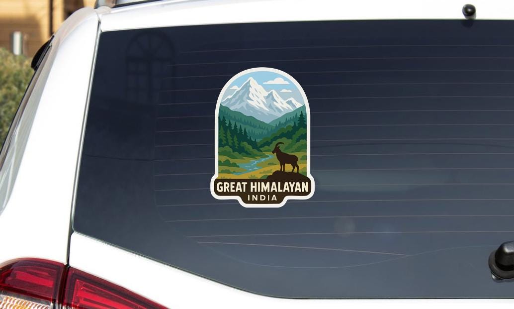A sticker on the rear window of a car that says "GREAT HIMALAYAN INDIA".