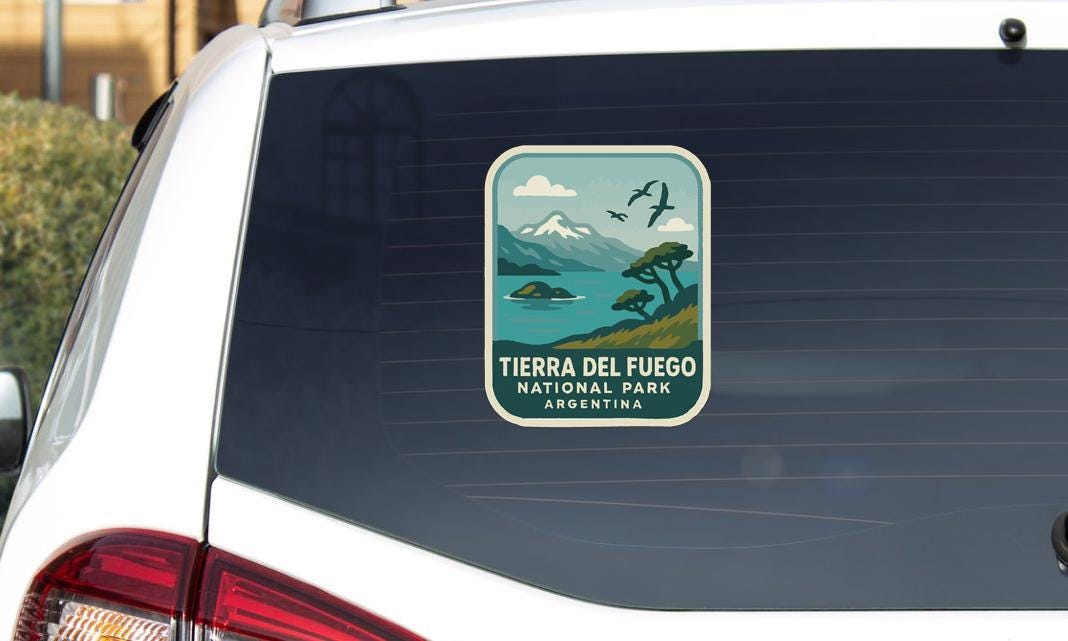 A sticker on the rear window of a car that says "TIERRA DEL FUEGO NATIONAL PARK ARGENTINA".