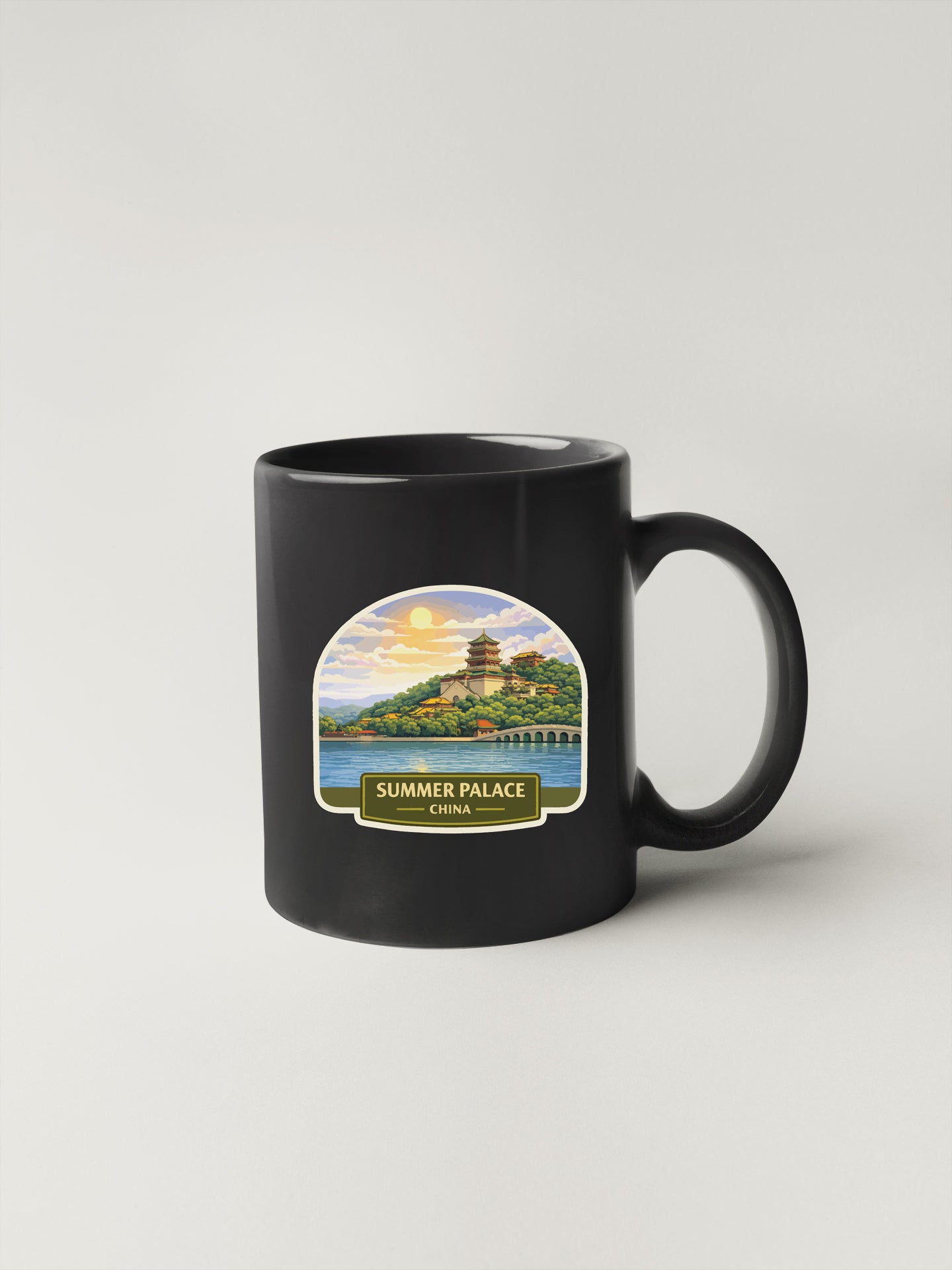 A black coffee mug with a label depicting the Summer Palace in China.