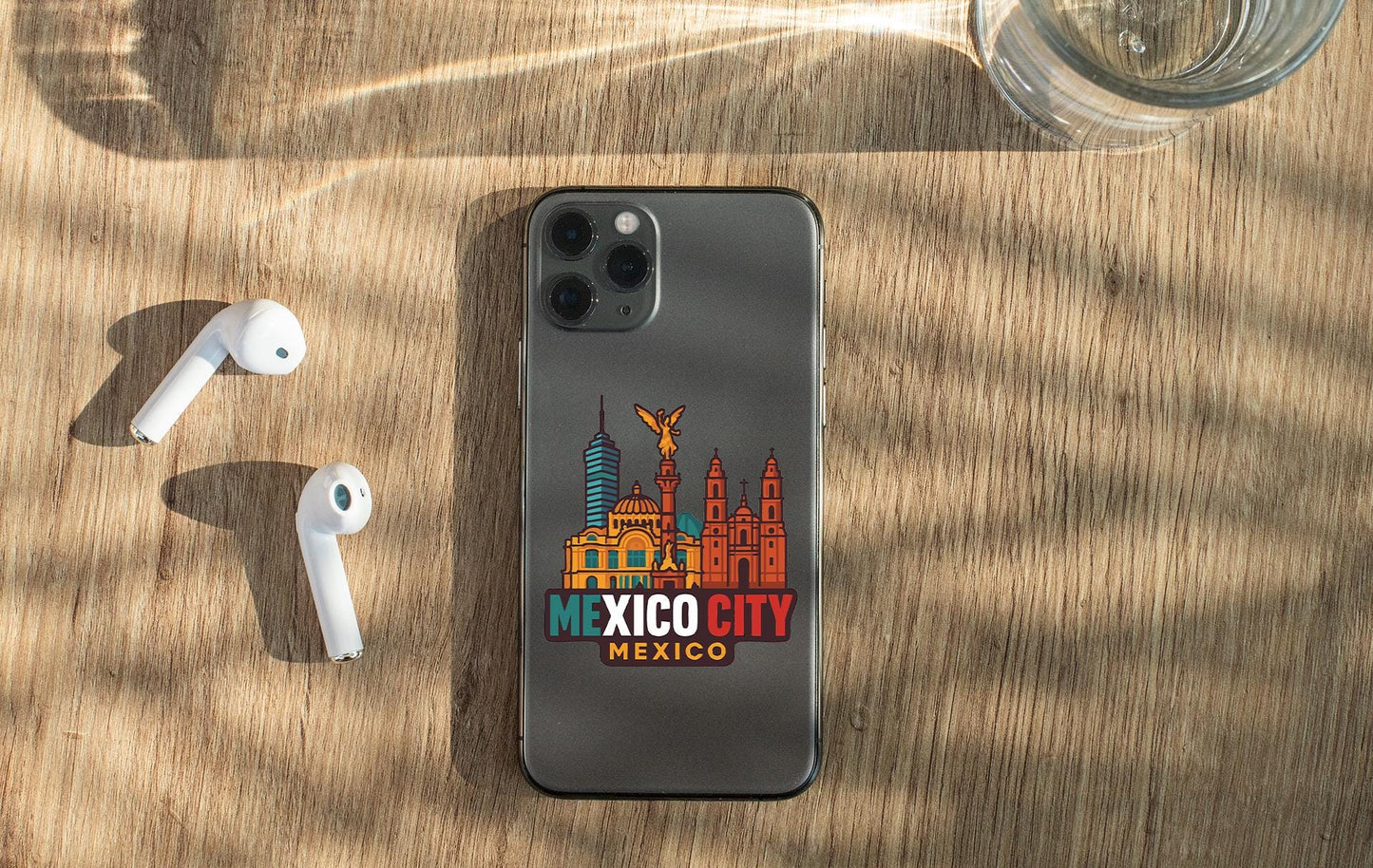 a phone and ear buds sitting on a table