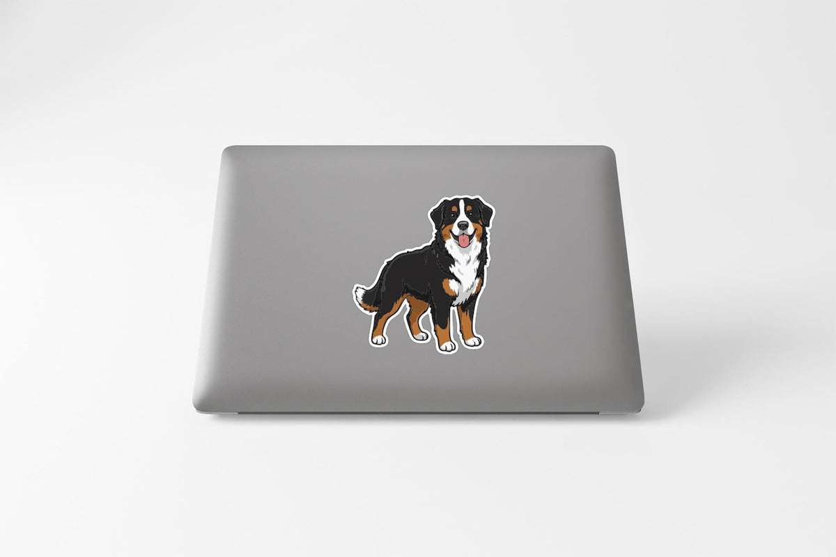 a sticker of a dog on the back of a laptop.